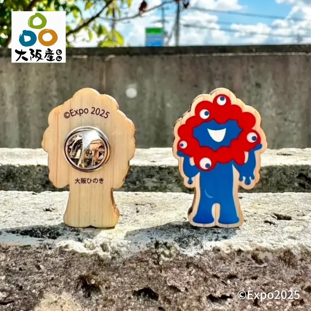 万博公式キャラクターに新デザイン登場！「黒ミャクミャク木製バッチ」発売。完売していたミャクミャク木製バッチも再販。 画像 4